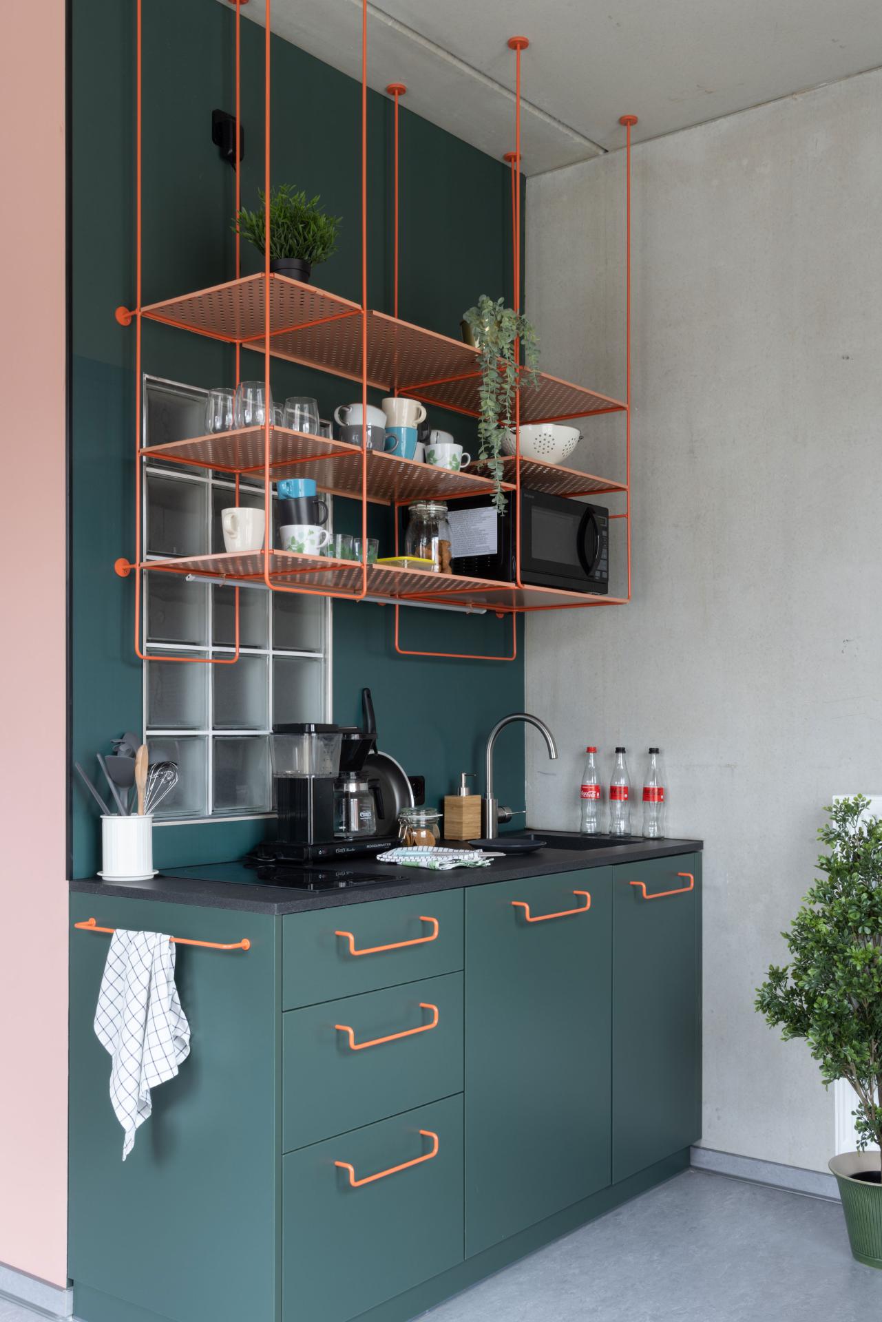 Kitchen area of a single L room with kitchenette at Basecamp Dortmund student housing