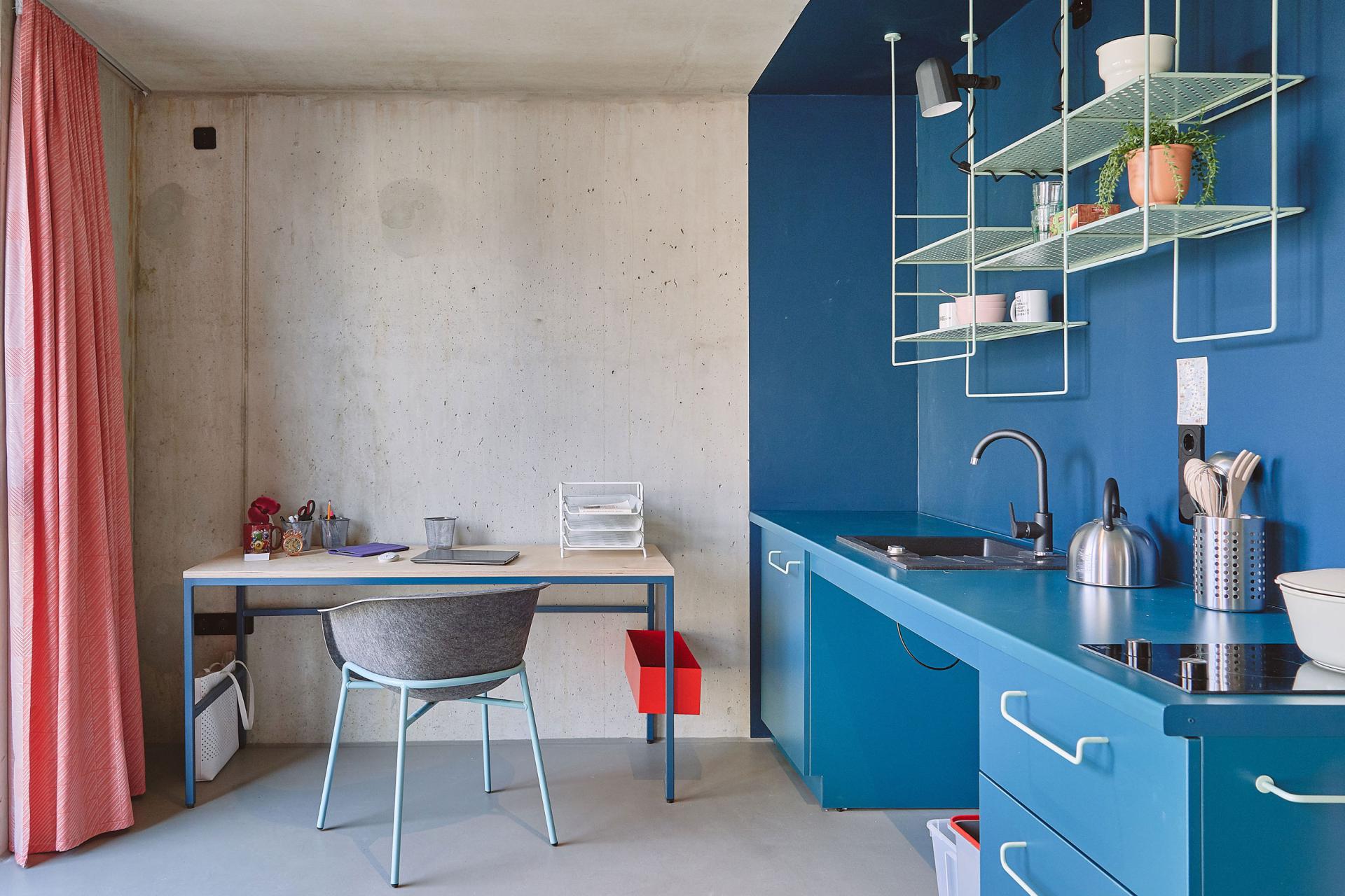 Blue kitchenette and sink in a studio room at our student accommodation in Leipzig