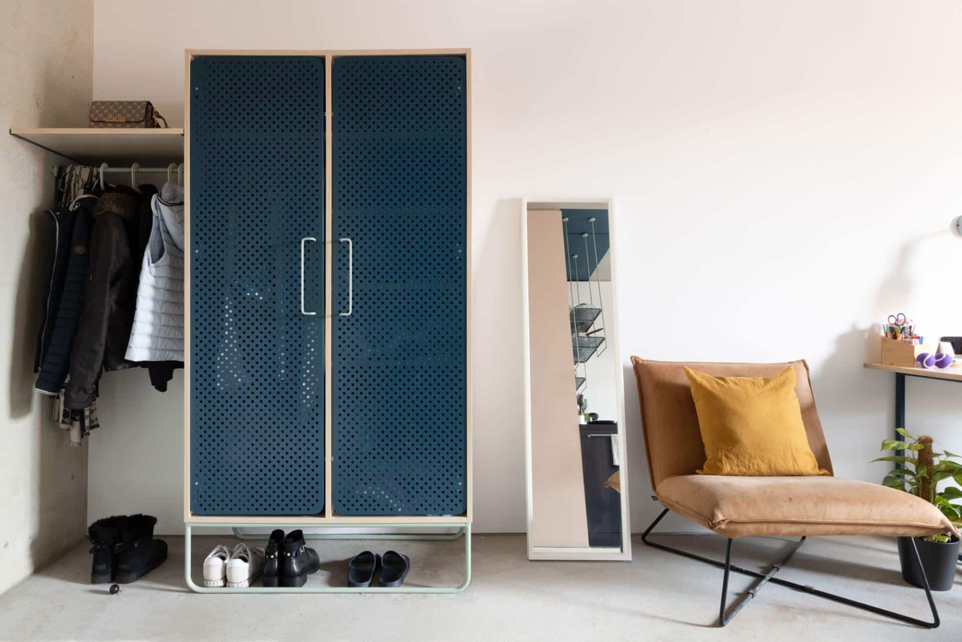 blue wardrobe and sofa in a student room at our Potsdam student dormitory