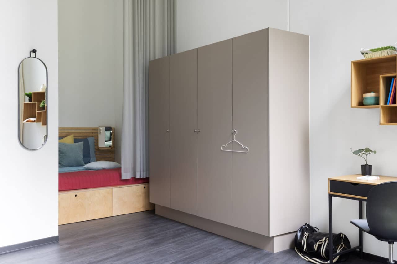 View of a modern wardrobe in a student room at Basecamp Lyngby dorm