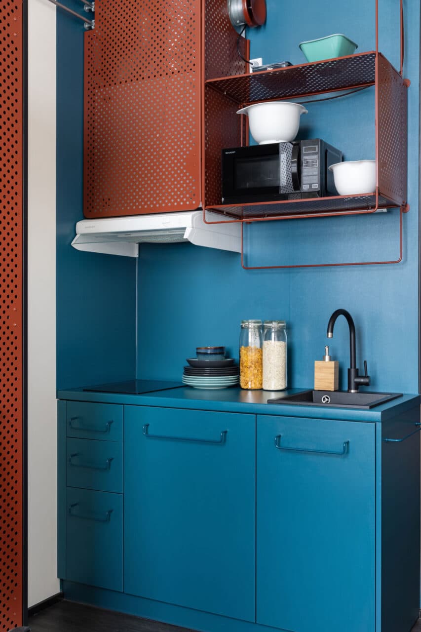 Blue kitchenette in a single room at Basecamp Copenhagen student dormitory