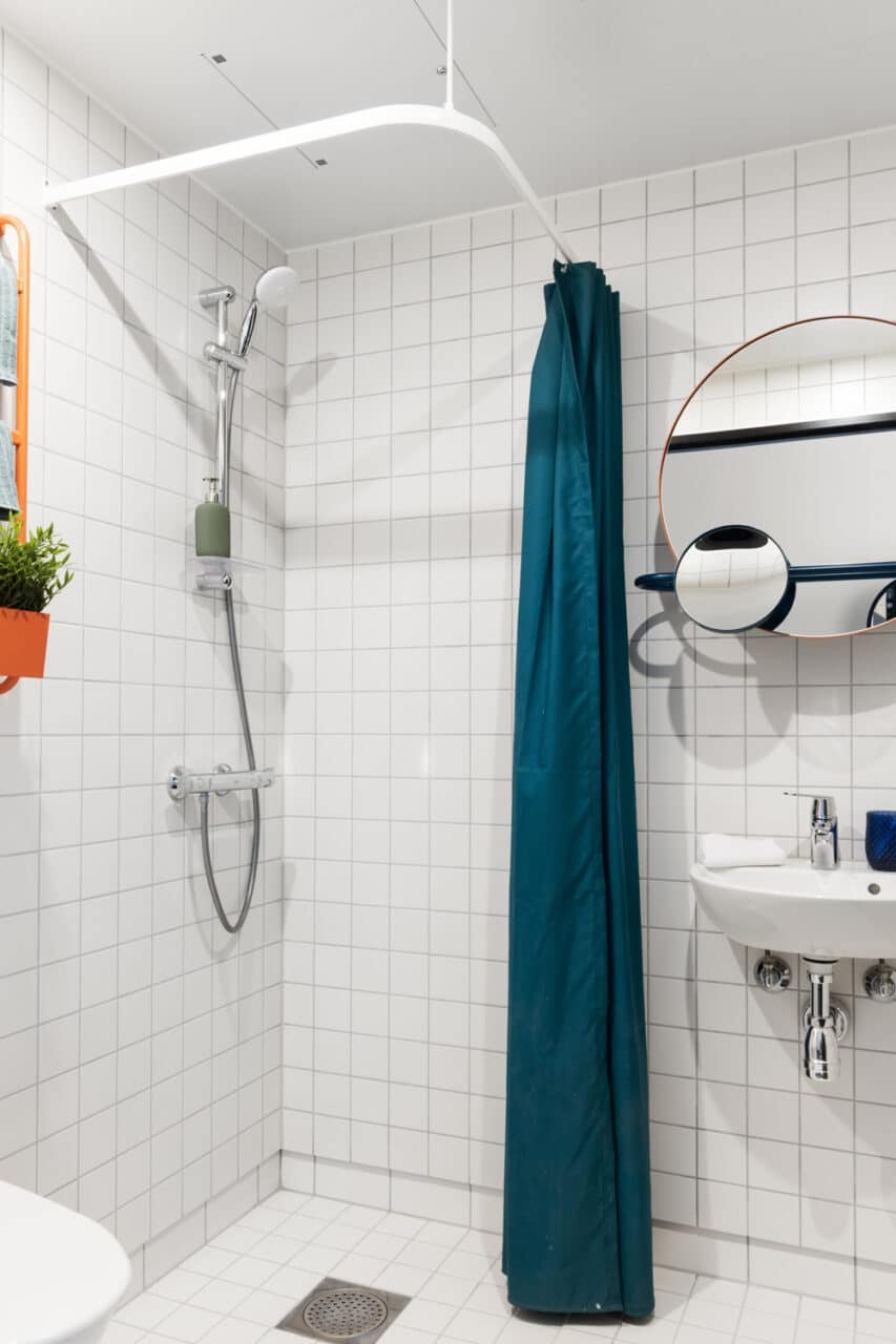 Shower and sink in the private bathroom of a student studio room in Basecamp Copenhagen