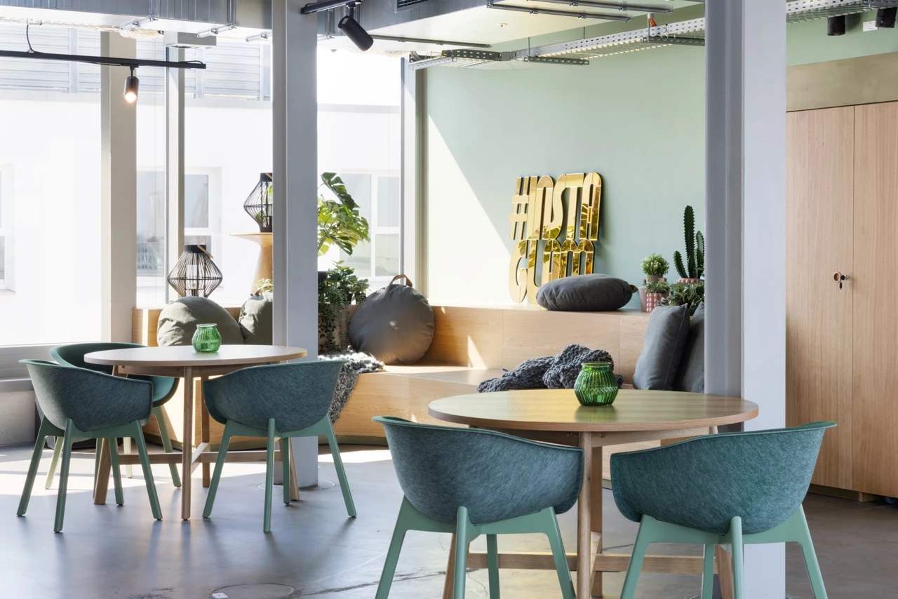 Sofas and dining tables in the Baseology area of Basecamp Dortmund dormitory