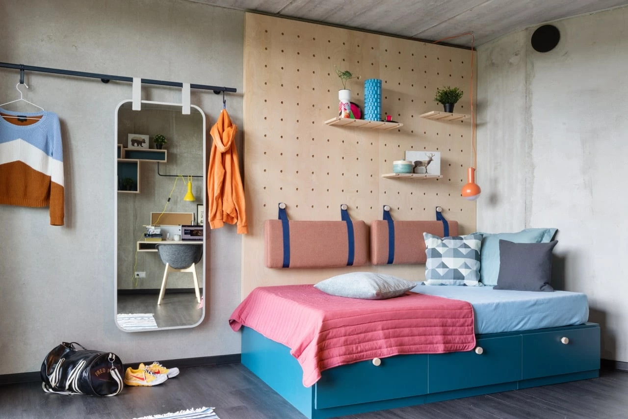 Bed area in a large room in Basecamp Lyngby student dorm