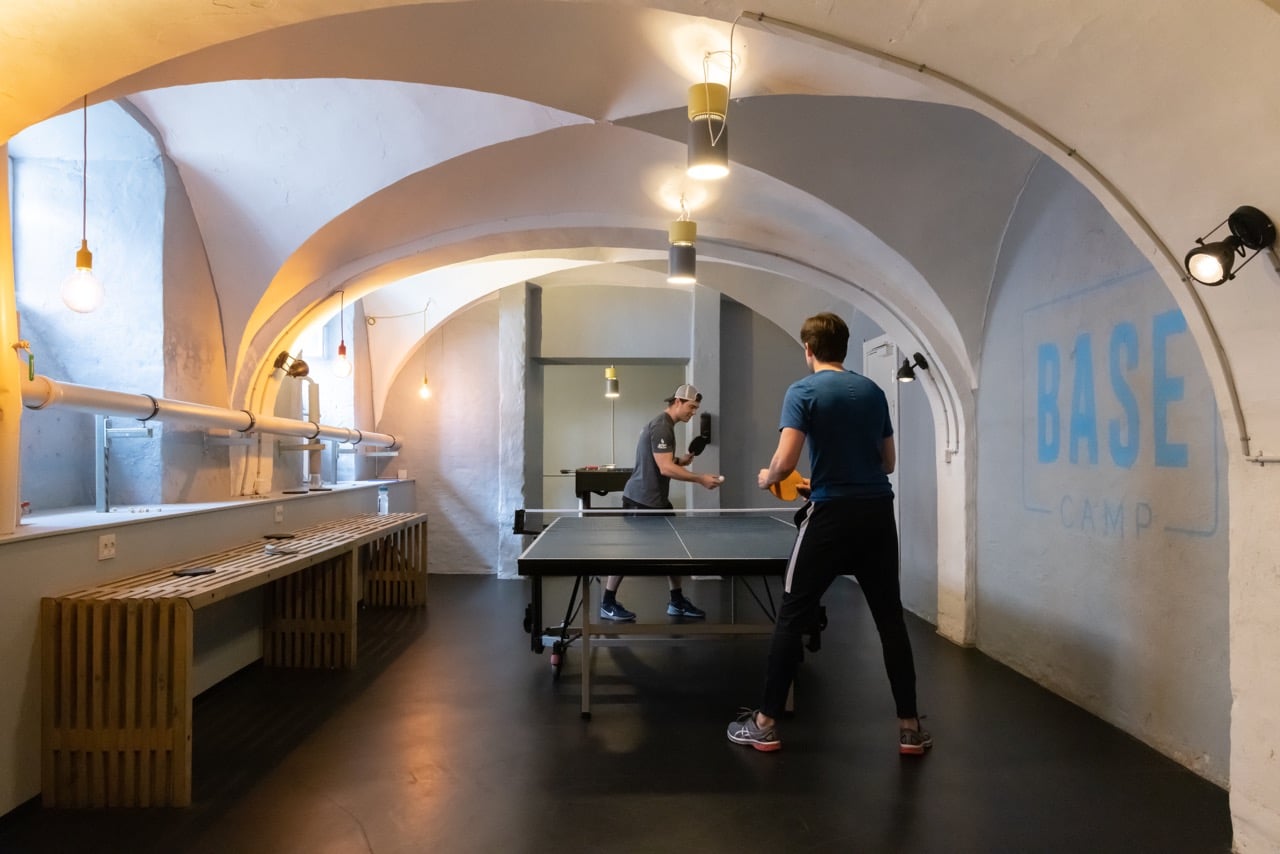 students playing pingpong in a Game Room at Basecamp Copenhagen student housing