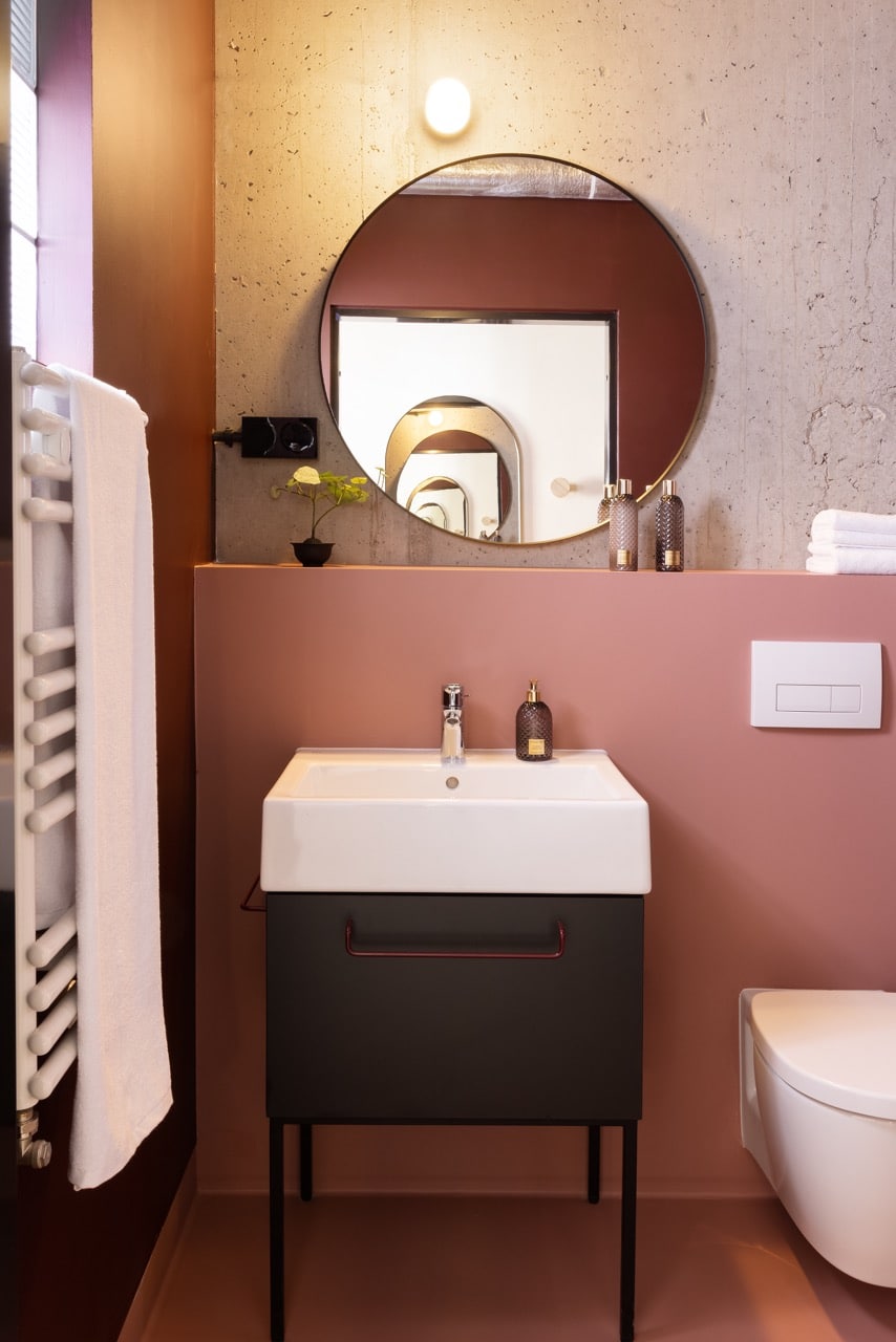 Bathroom with mirror in a hotel room at Basecamp Wrocław