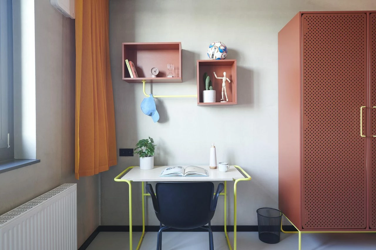 desk and wardrobre of a student L room in Basecamp Gottingen