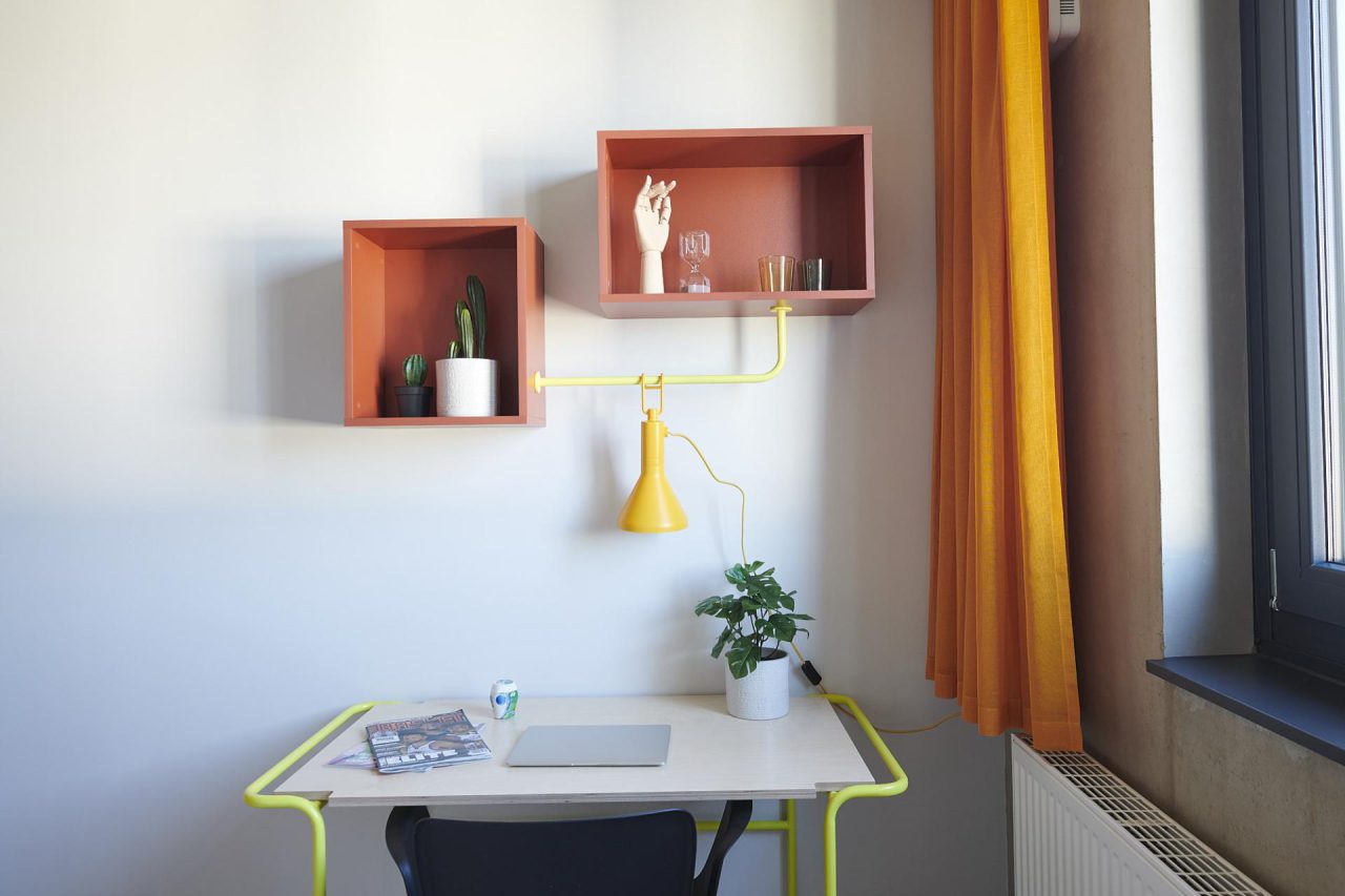 Desk with laptop at Basecamp Gottingen's studio room