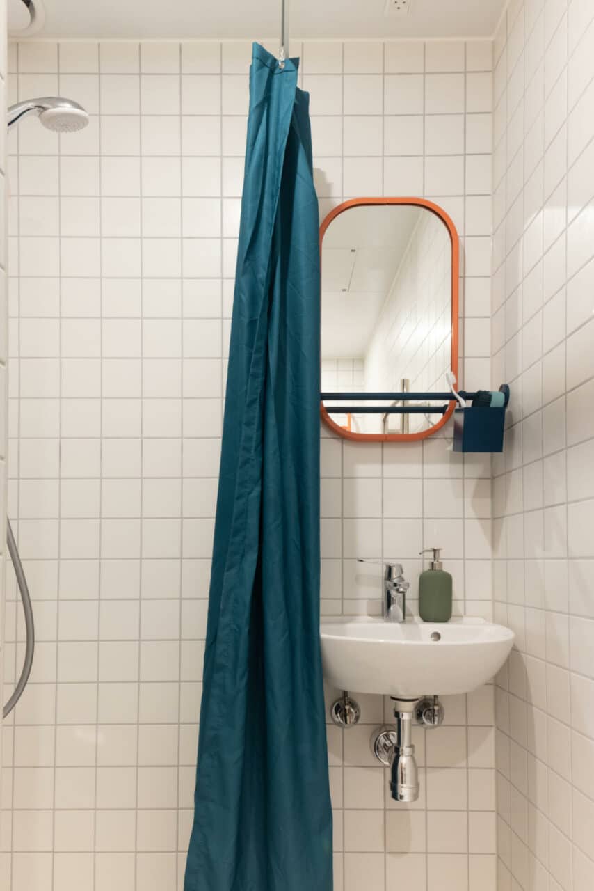 Shower and sink in the private bathroom of a student room in Basecamp Copenhagen