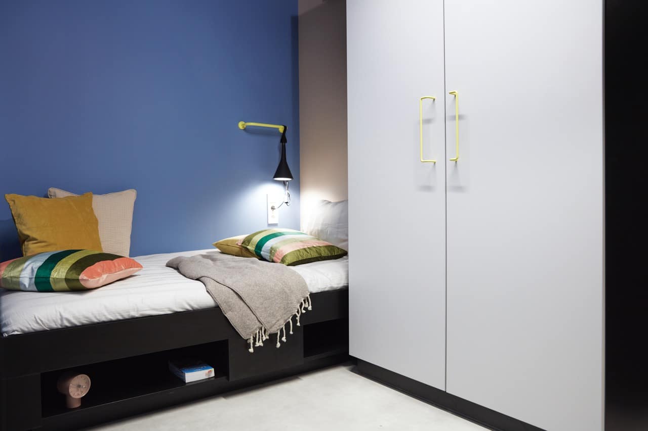 Studio terrace bed and wardrobe at Basecamp Malmö student accommodation