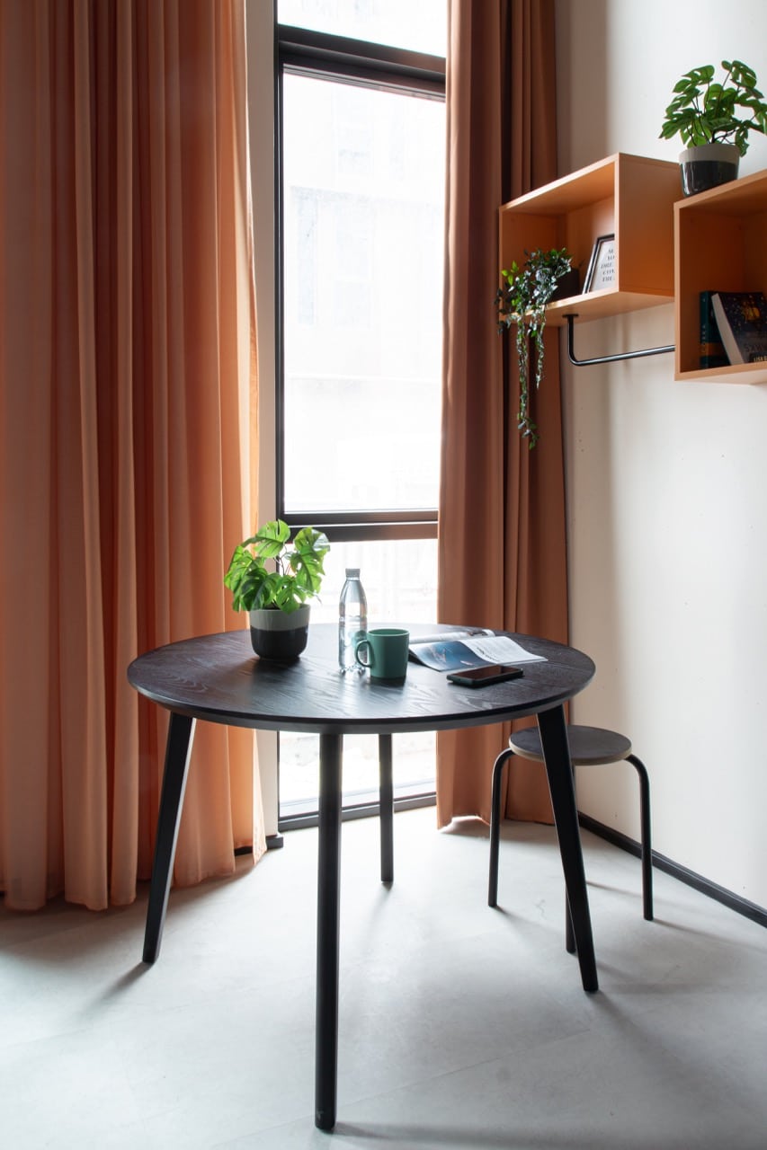 Dining area of a large studio room in Basecamp Aarhus student accommodation