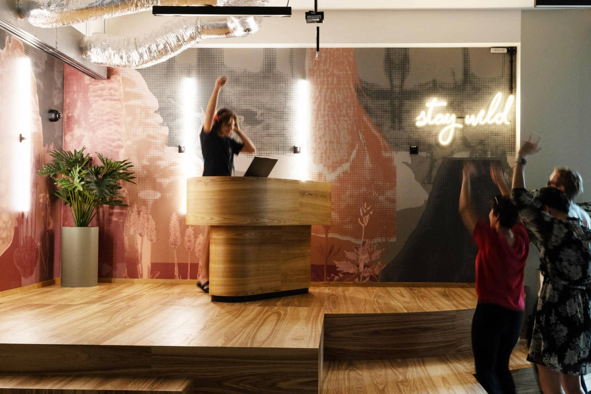 A DJ plays music while students dance at an event area at our dormitory in Wroclaw