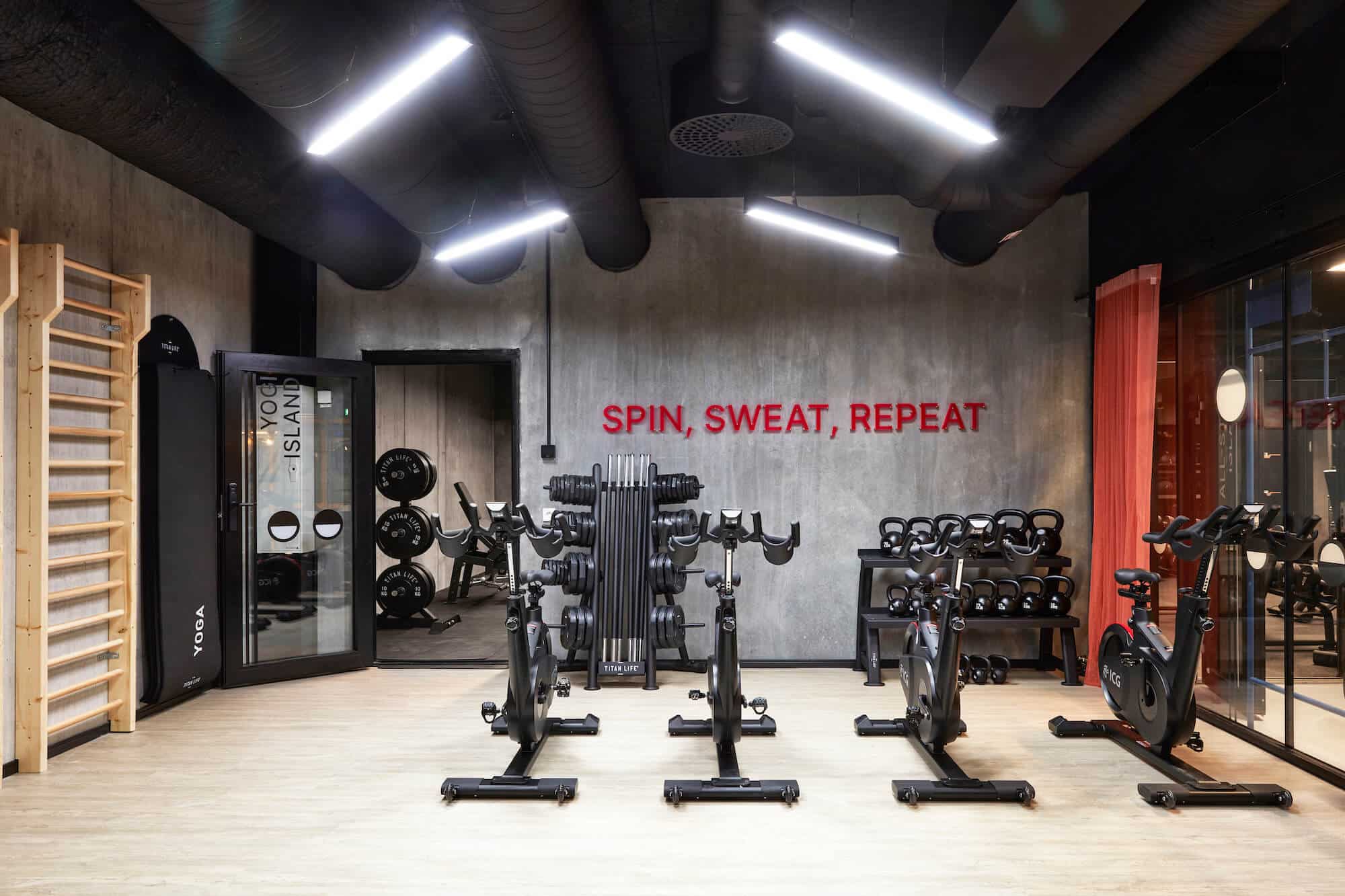 Exercise bikes and weights in the 24/7 gym at Basecamp Malmö student housing