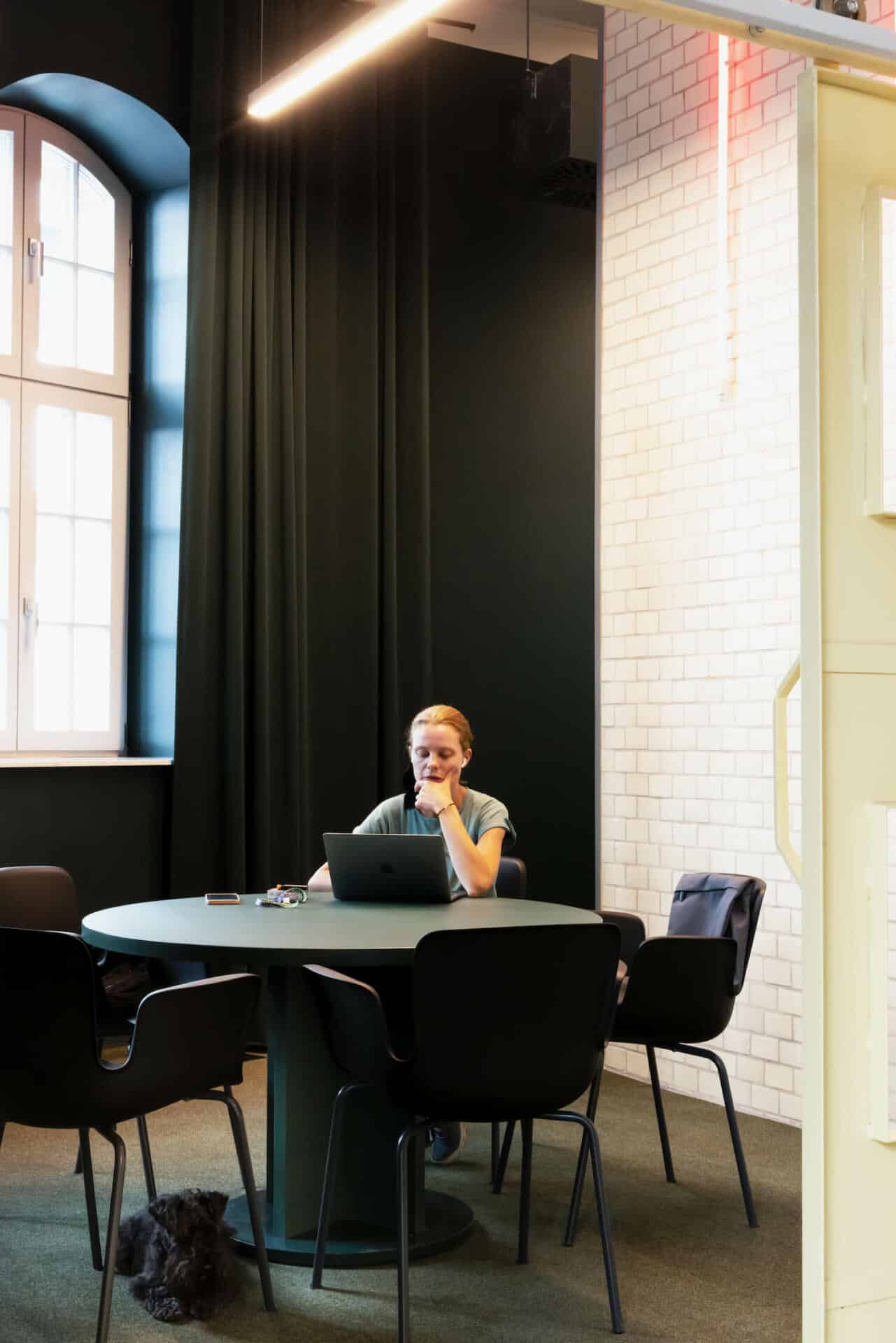 A student working on her laptop in a quiet study space at our Wroclaw dormitory