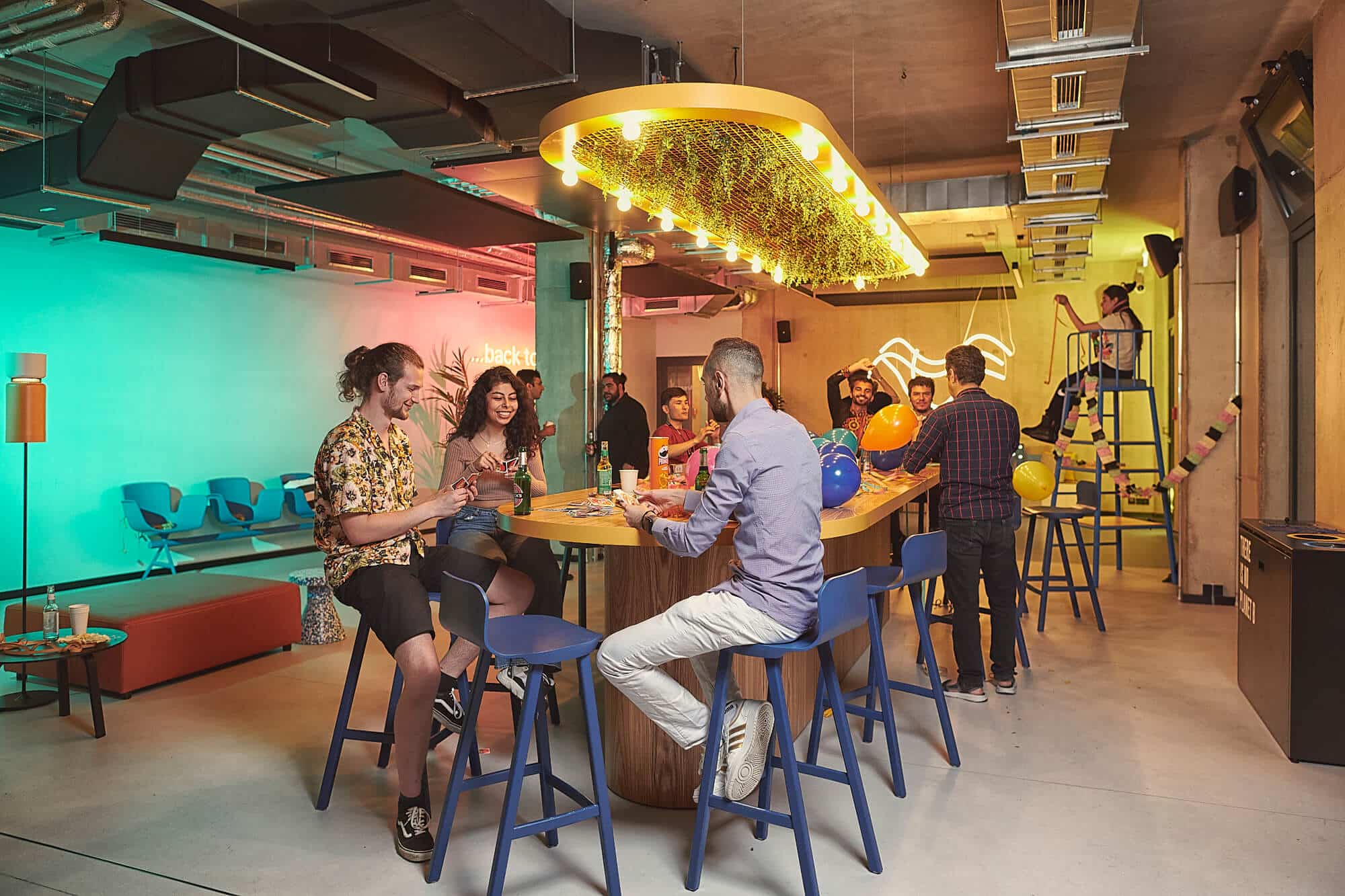 A group of students hang out in the communal area 