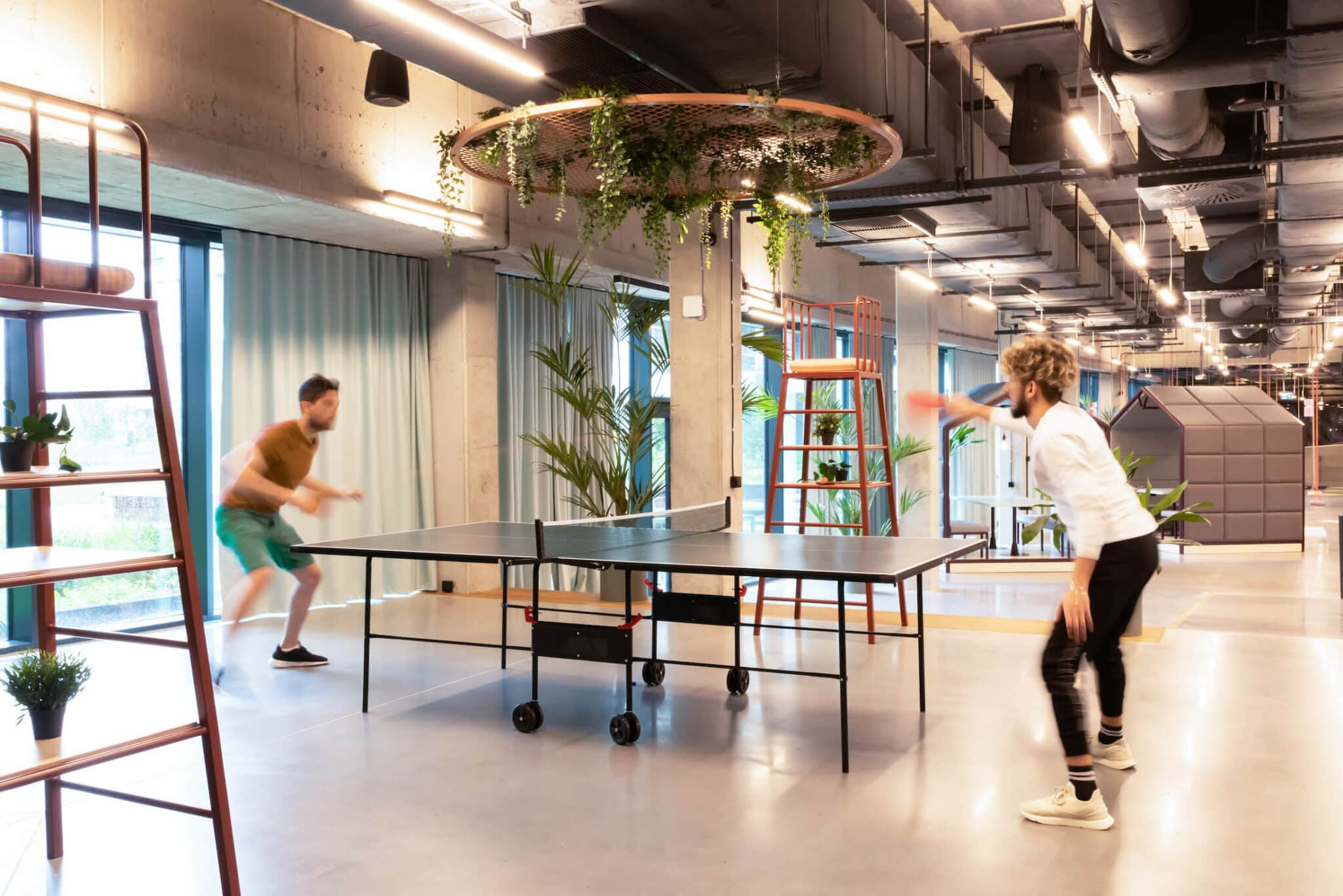 Two people playing table tennis at Basecamp Łódź Rembielińskiego Student housing