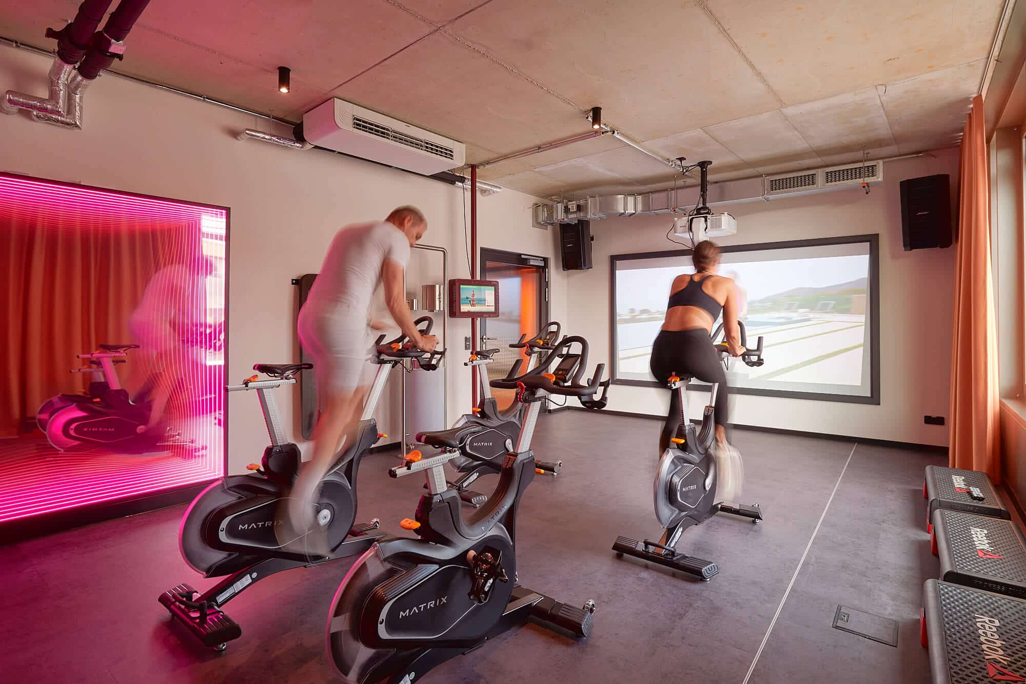 Exercise bikes in the fitness room at Basecamp Dortmund Student dormitory