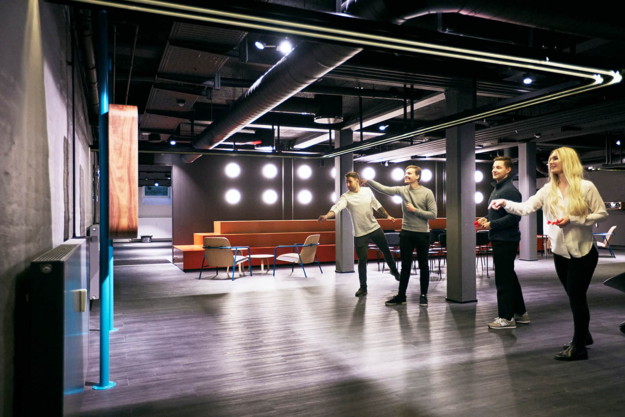 Students play a game of darts in the Game Zone at Basecamp Copenhagen dorm