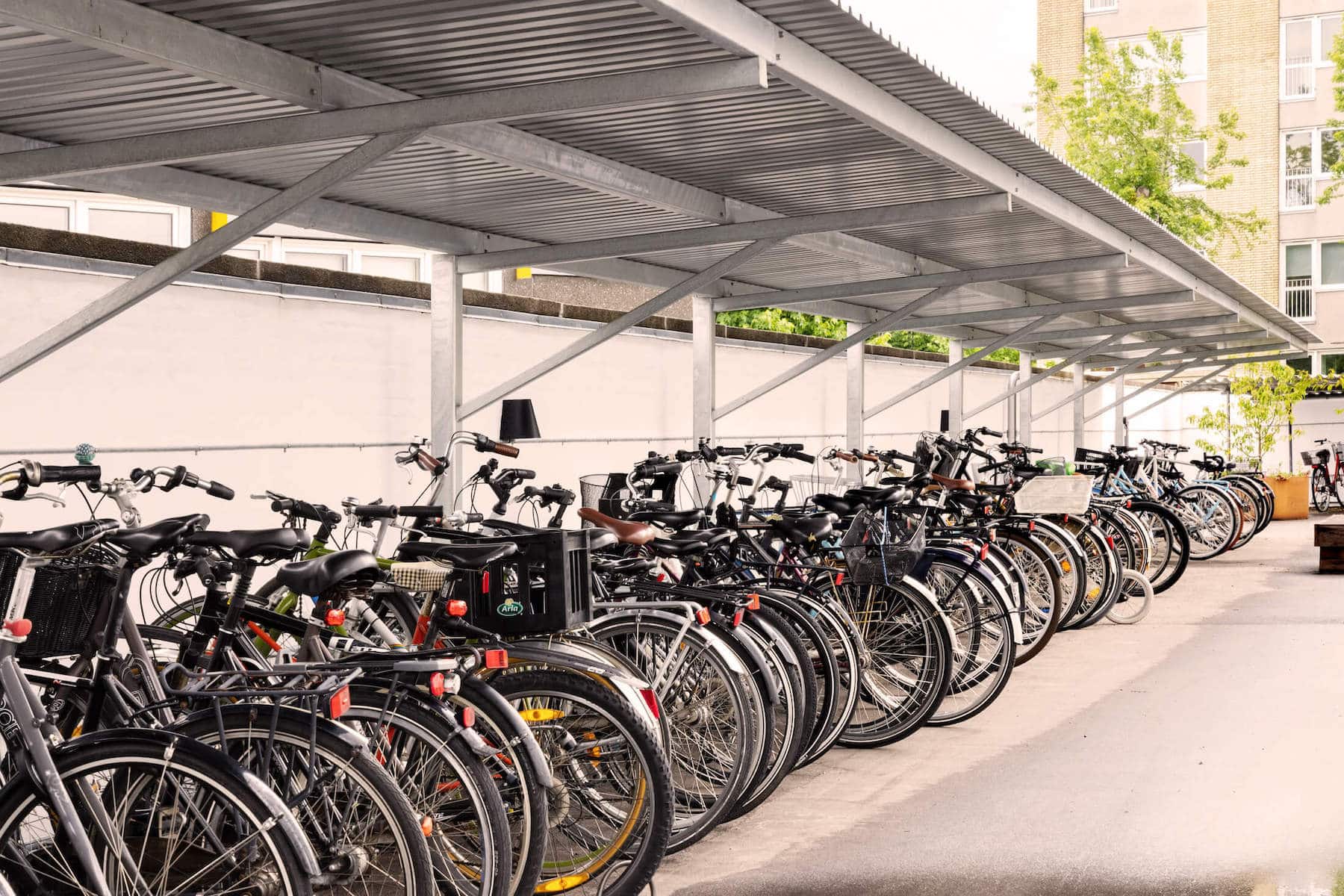 Many bikes parked at Basecamp Copenhagen dorm's outdoor area