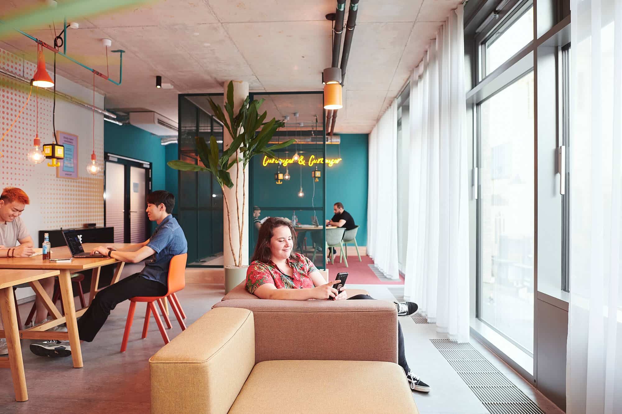 Students in a quiet study area with sofas at Basecamp Dortmund student accommodation