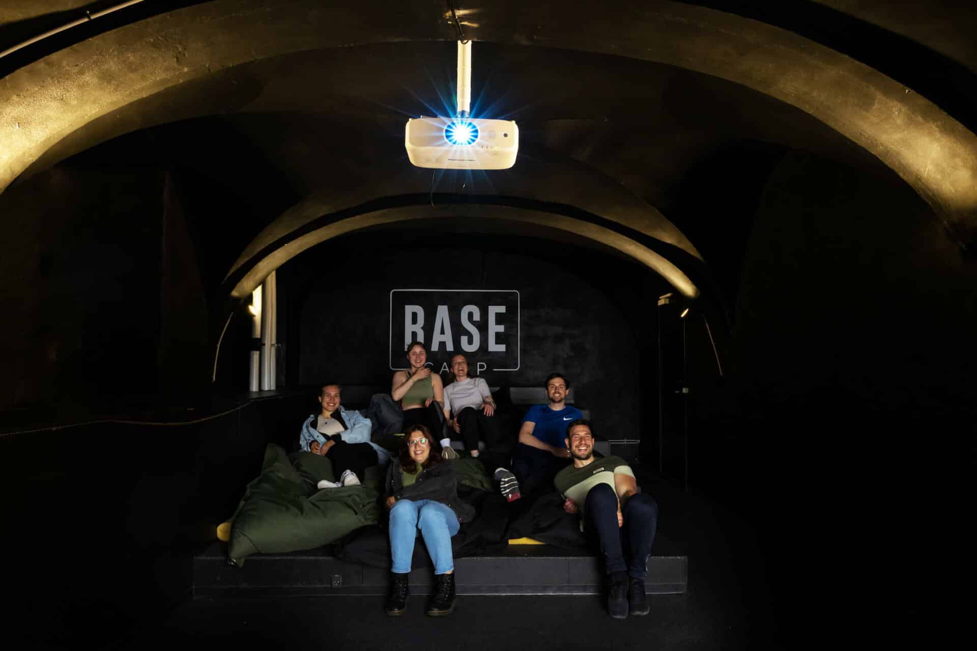 Students laugh while watching a comedy movie in the Cinema Room at our Student Dormitory in Copenhagen City