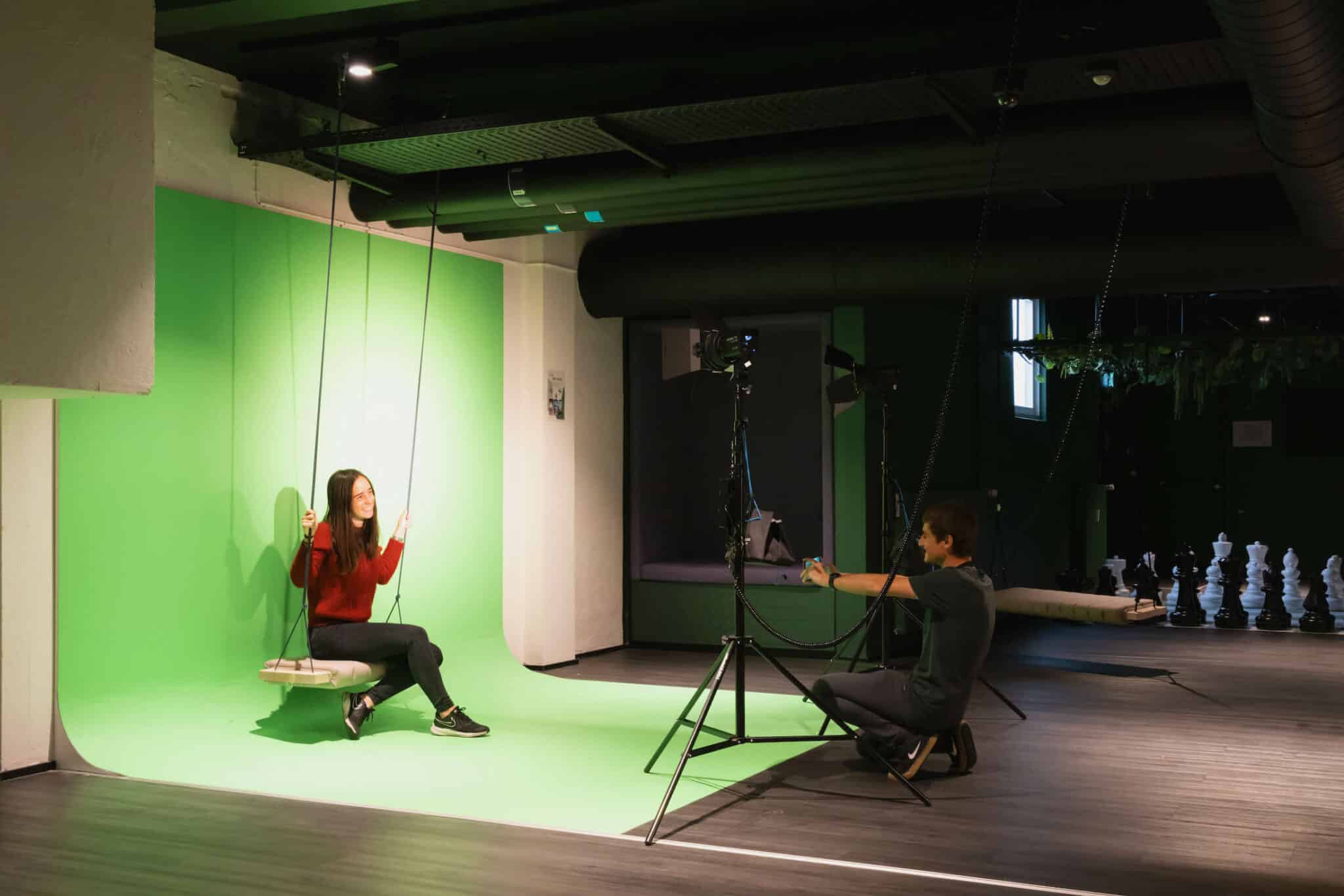 Students record a video with a green screen in the Game Room at Basecamp Copenhagen dormitory 