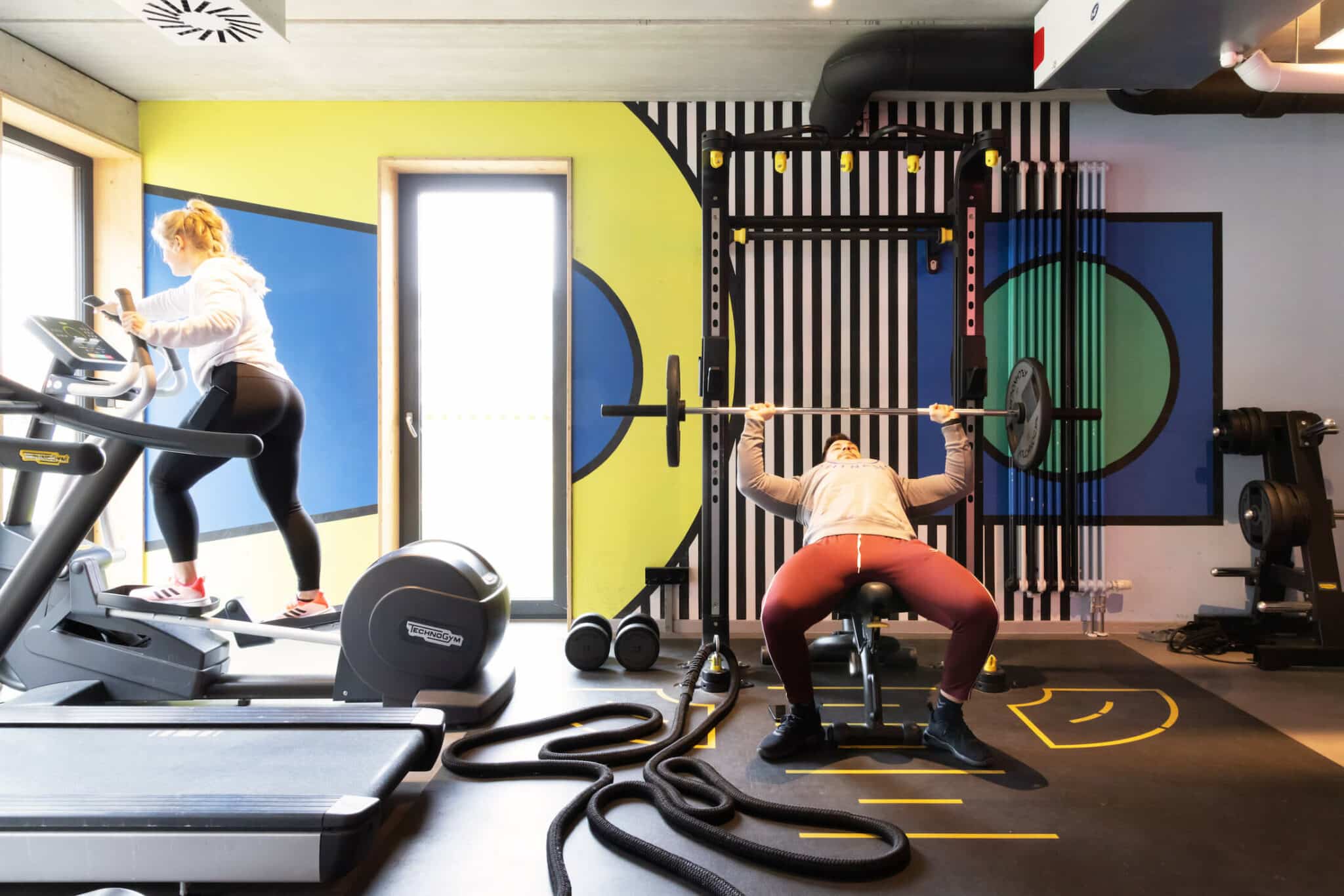 sudents work out i with weights and machines in our state of the art gym at Basecamp Potsdam student dormitory