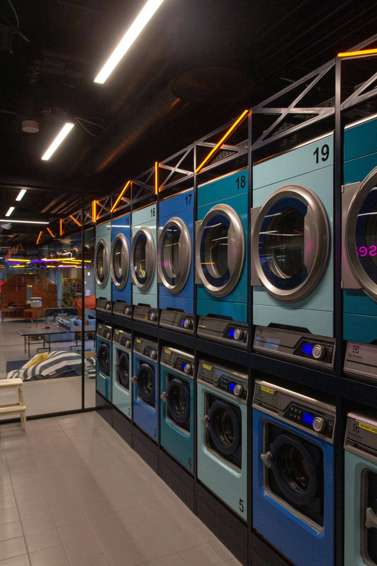 washing machines and tumble dryers in the 24/7 laundry room at Basecamp Aarhus student accommodation