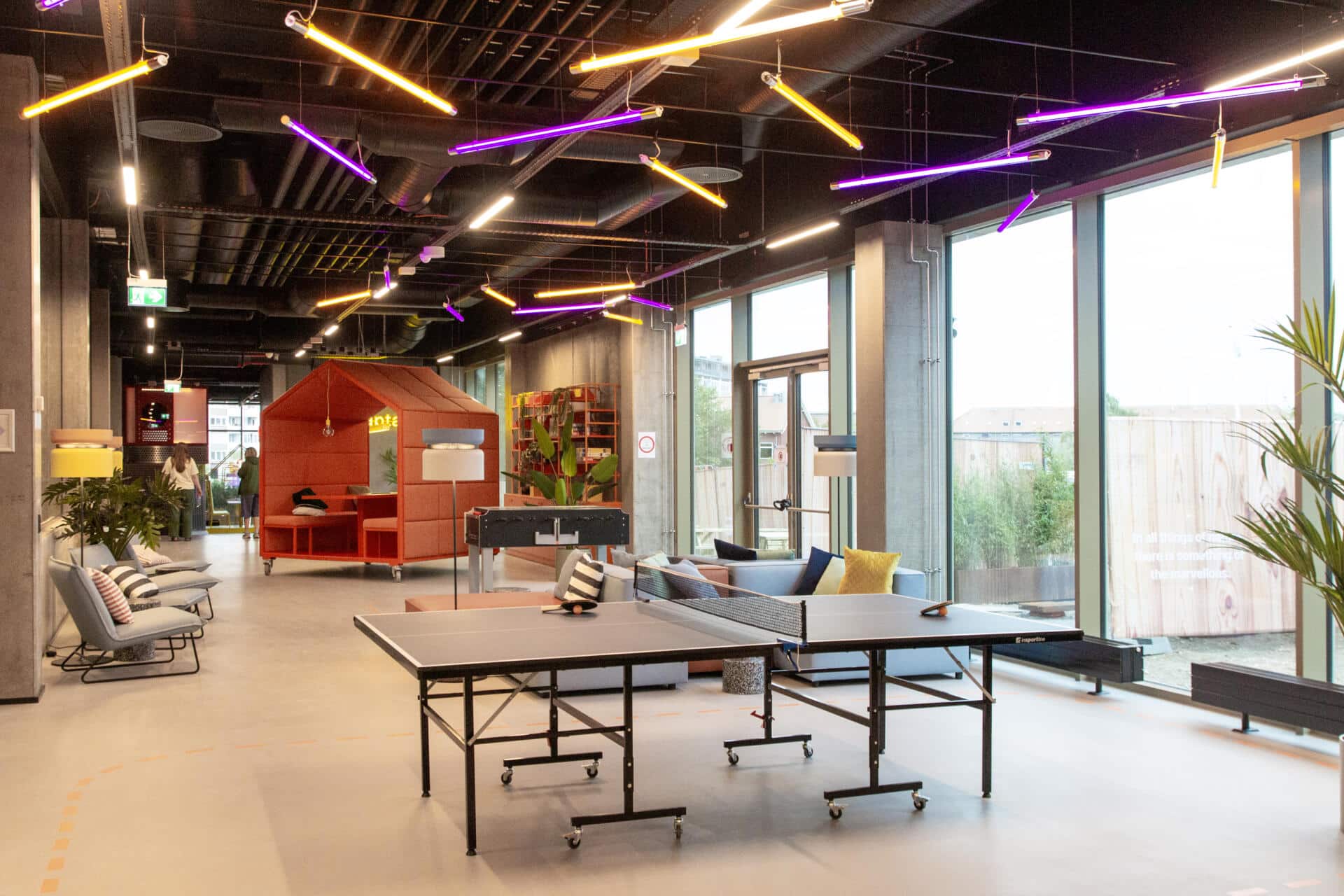 game zone at Basecamp Aarhus student dorm with sofa area and table tennis table
