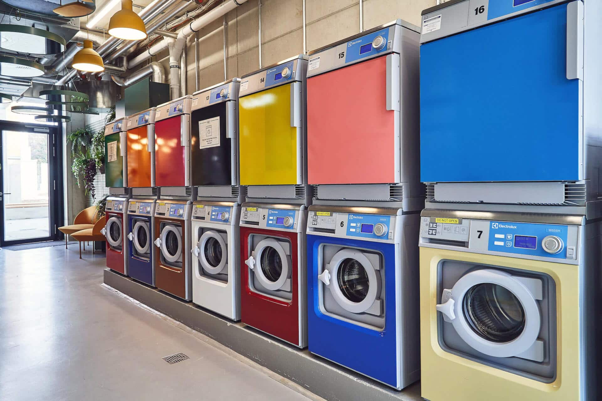 Colourful and modern laundry machines at Leipzig student accommodation laundry room