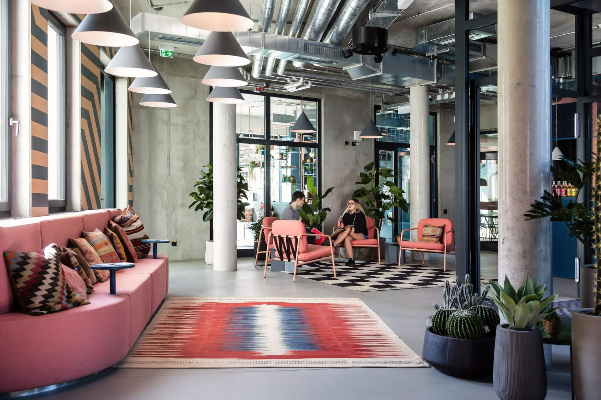 Students chat in one of the Lounge Areas at Basecamp Leipzig student accommodation