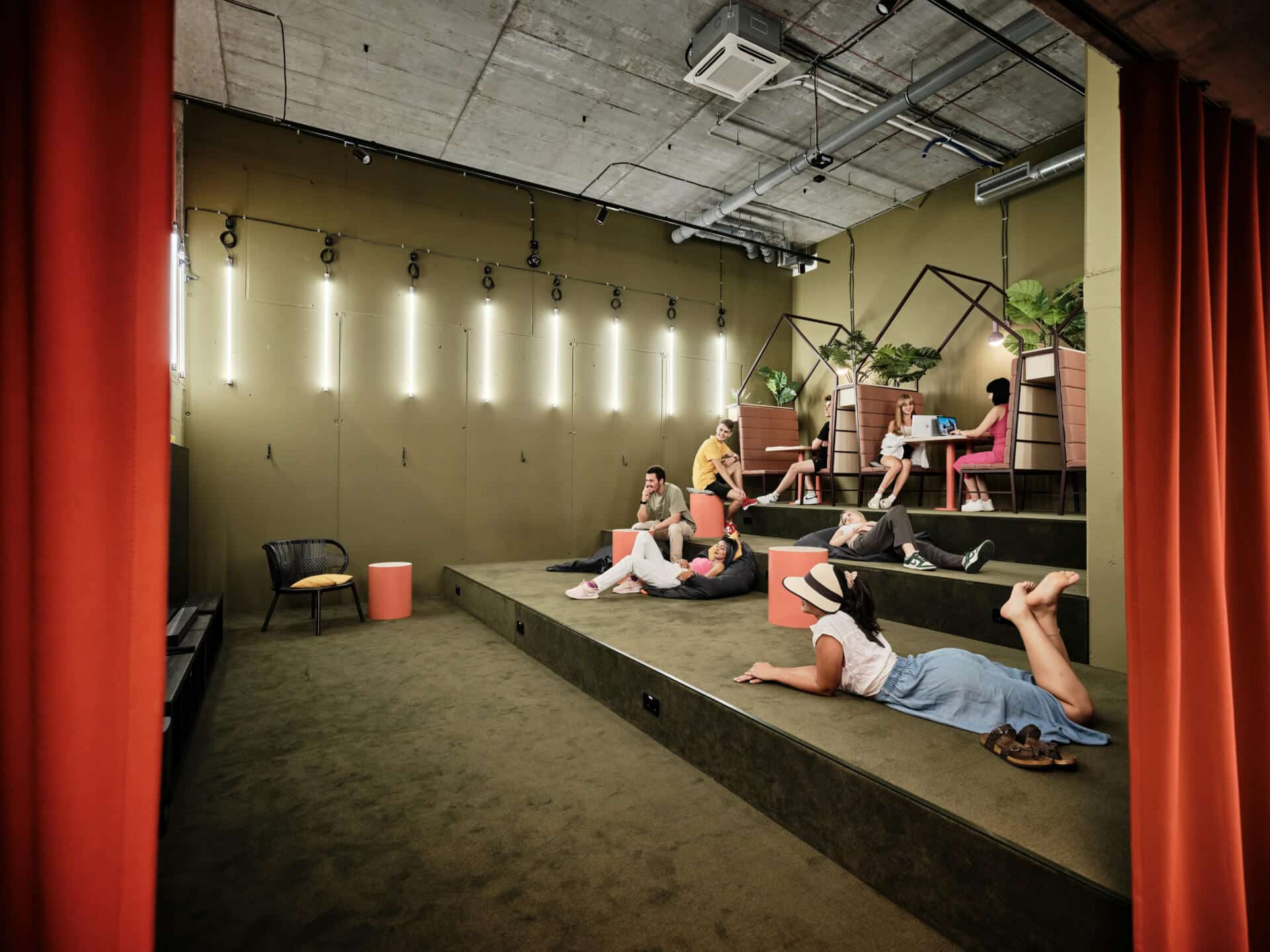 Students enjoying a film and studying in one of the communal areas at Basecamp Katowice student dorm