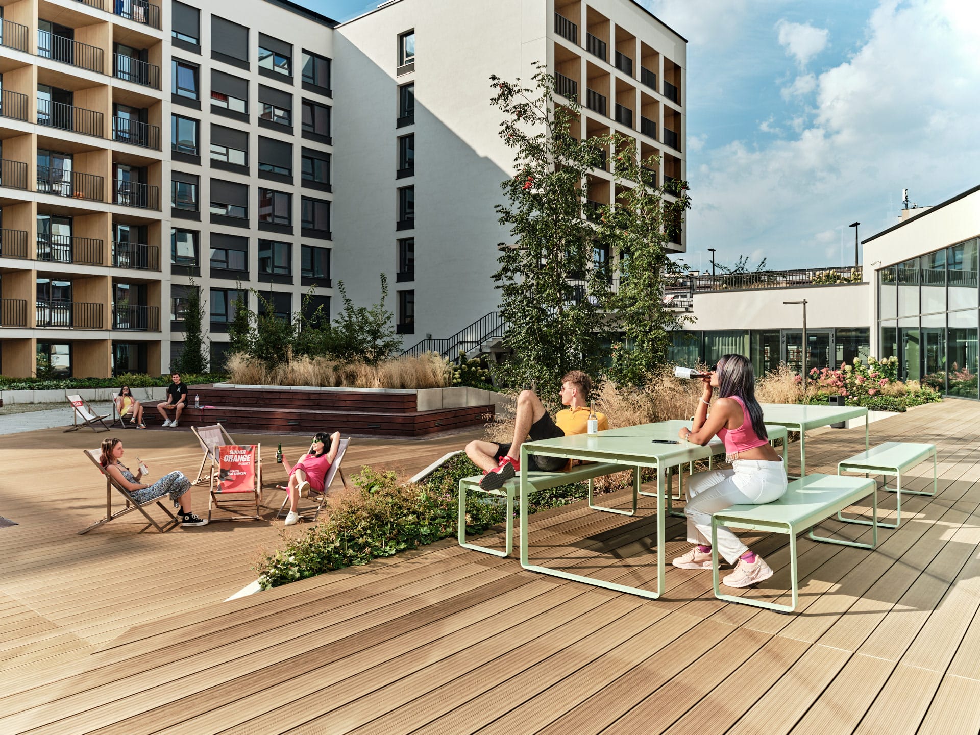 students enjoying the outdoor area at Basecamp Katowice student dormitory