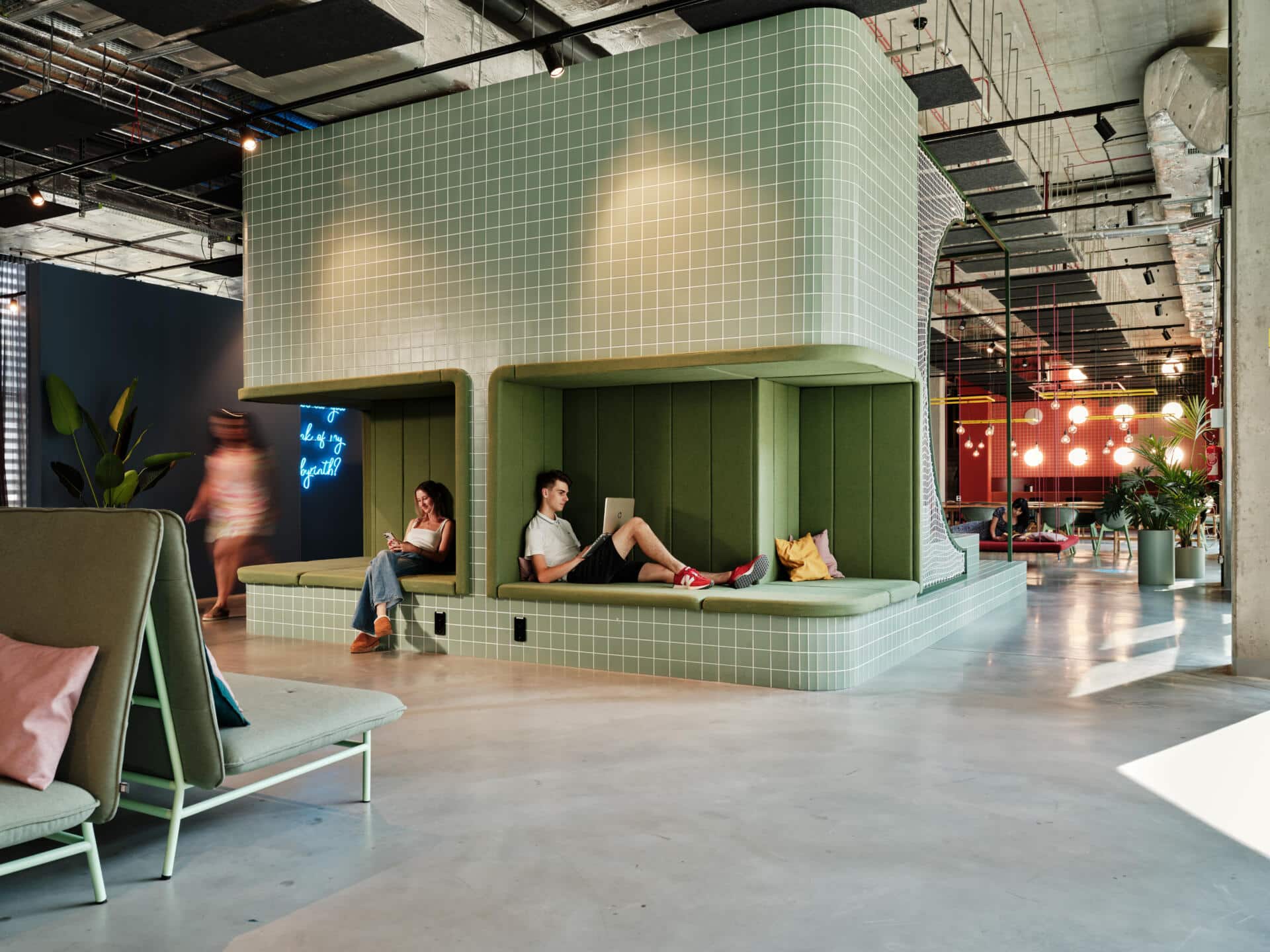 Students read in a relax area at Basecamp Katowice dormitory