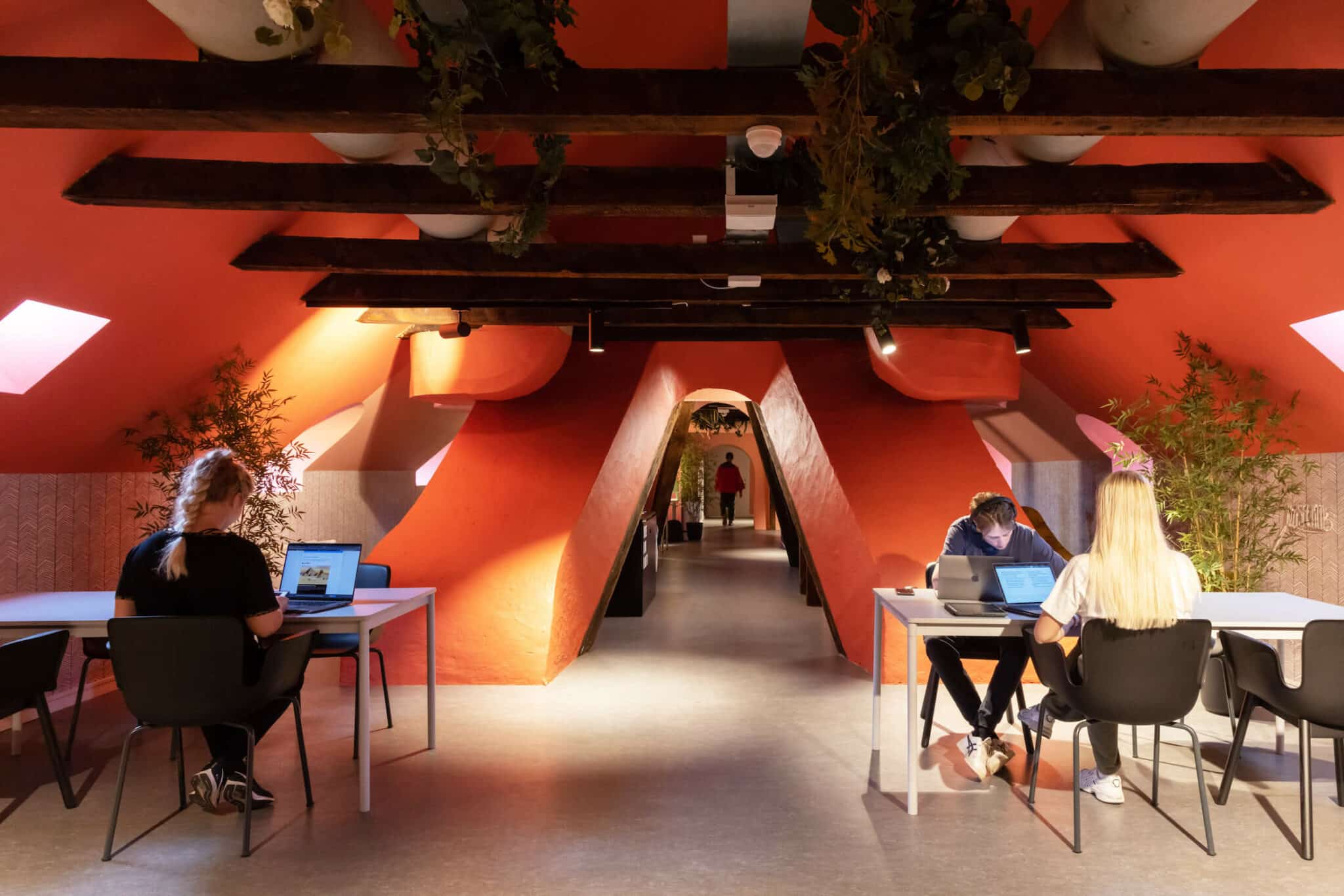 Student residents studying in one the study spaces at Basecamp Copenhagen student housing