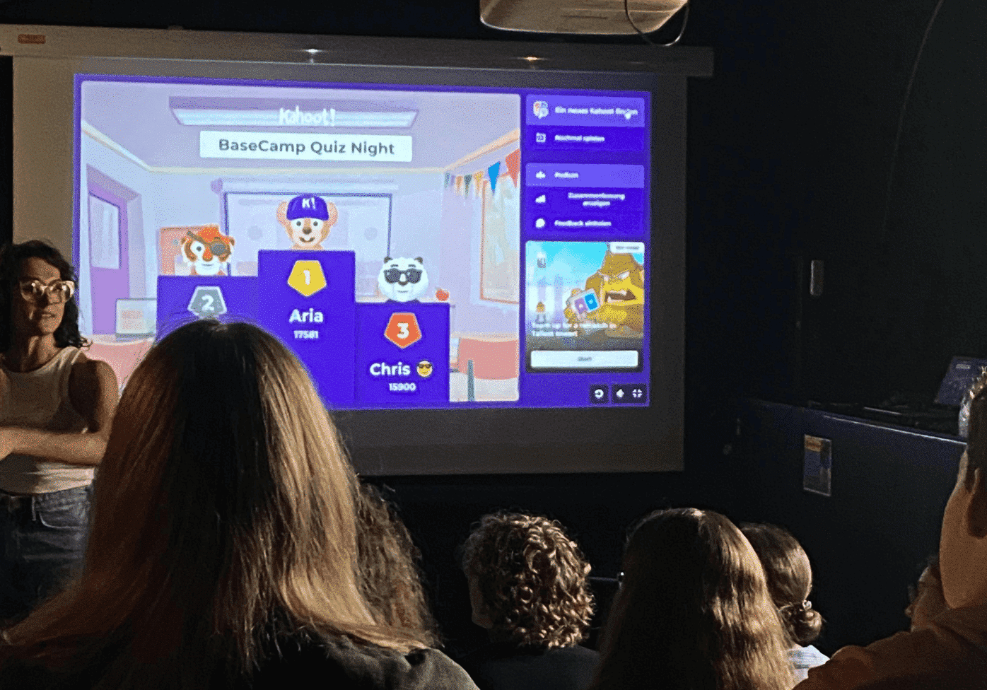 A group of students play videogames in the Cinema Room at Basecamp Copenhagen student housing