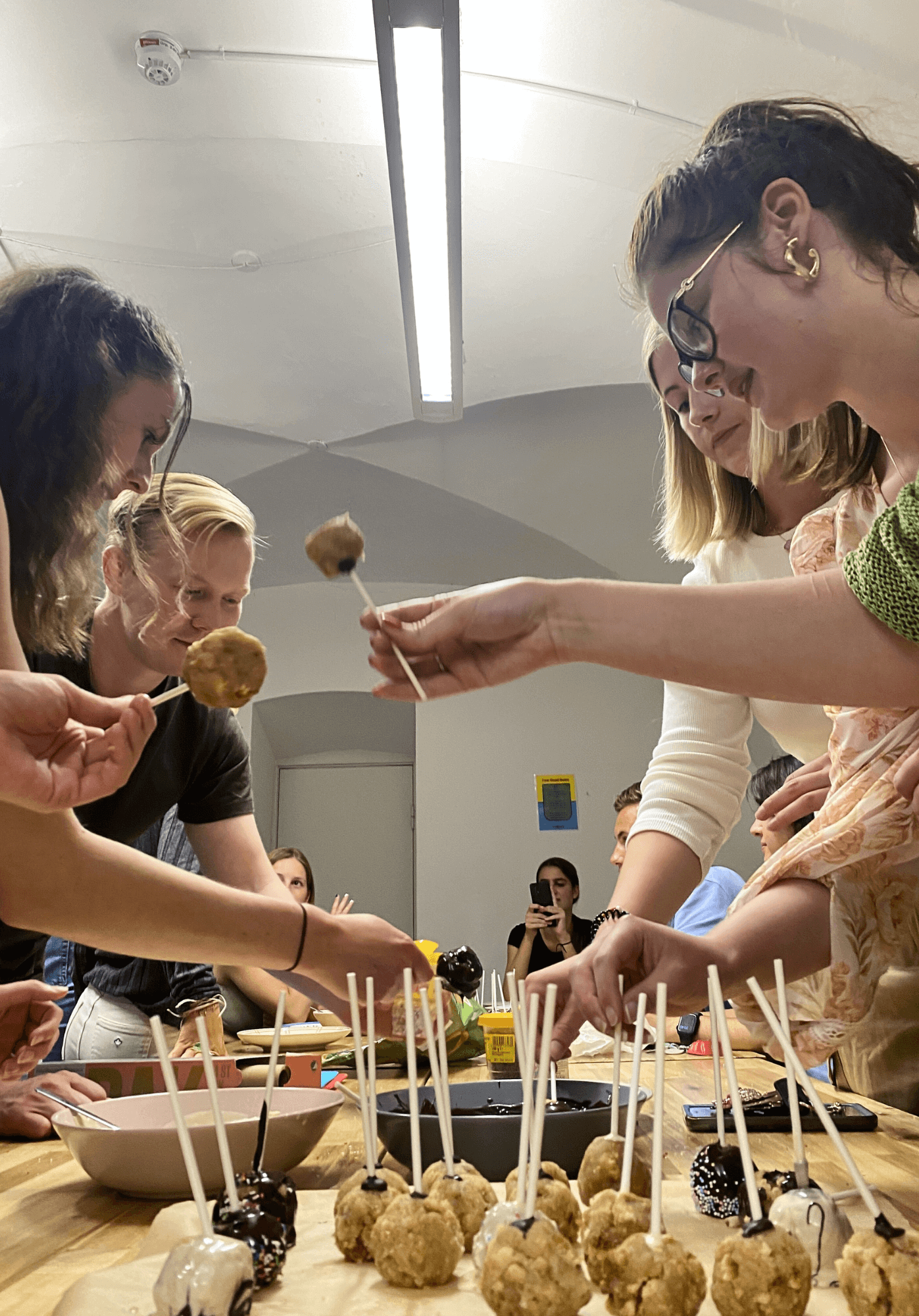 Students prepare a meal in one the common kitchen spaces at Basecamp Copenhagen student housing