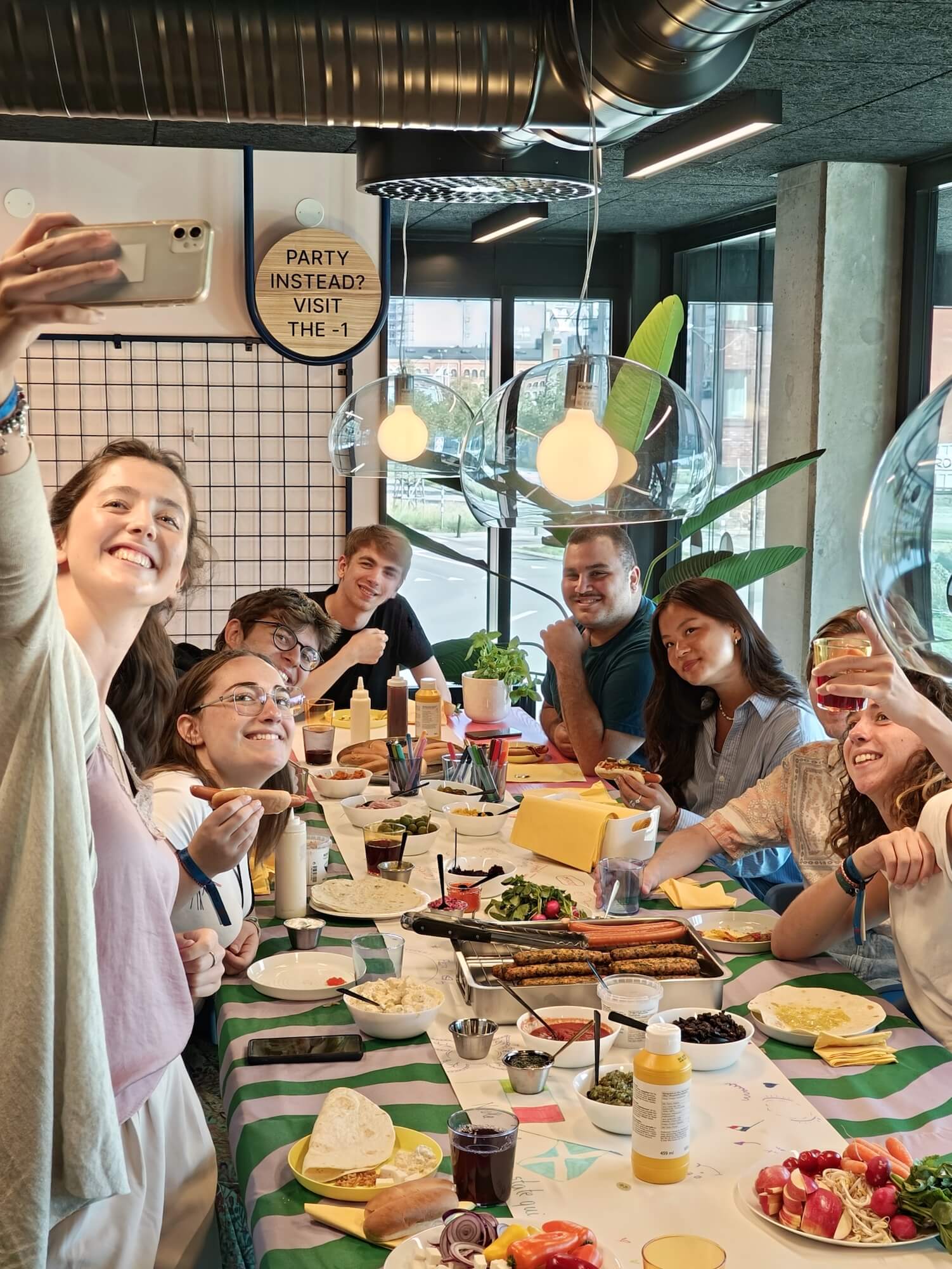 Student residents at Basecamp Malmö student housing enjoying food together in one of the communal kitchens