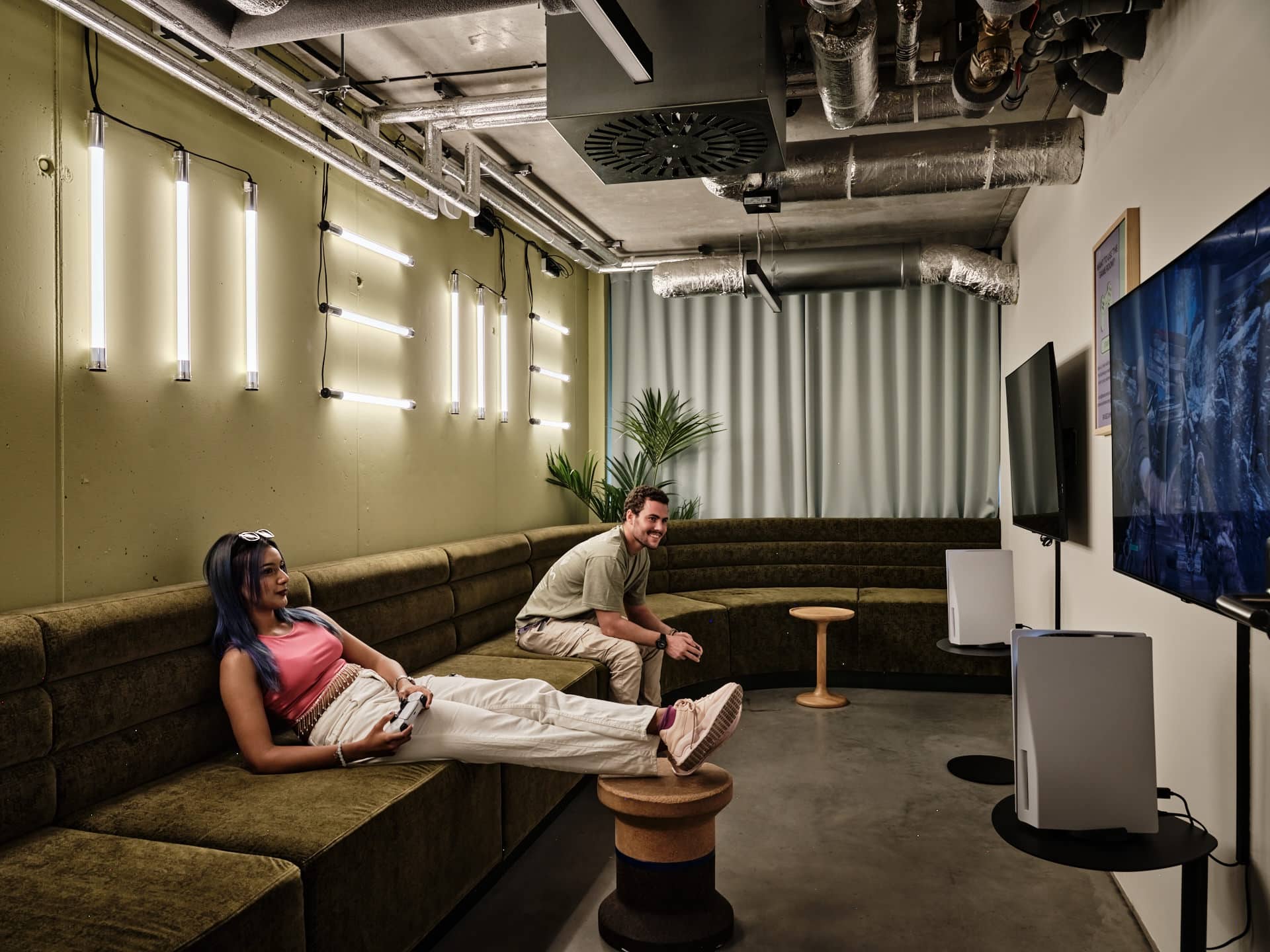 students play PS5 in a Game Room at Basecamp Katowice student accommodation