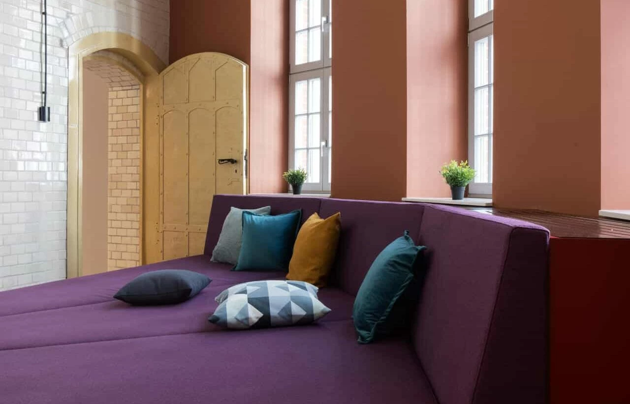 Game Room with purple sofas at Basecamp Wroclaw student dormitory