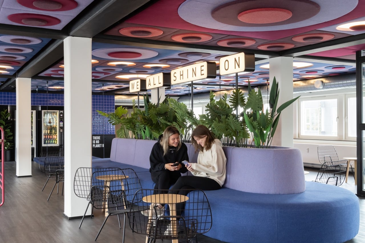 Two students chatting in a Relax Area at Basecamp Copenhagen dormitory